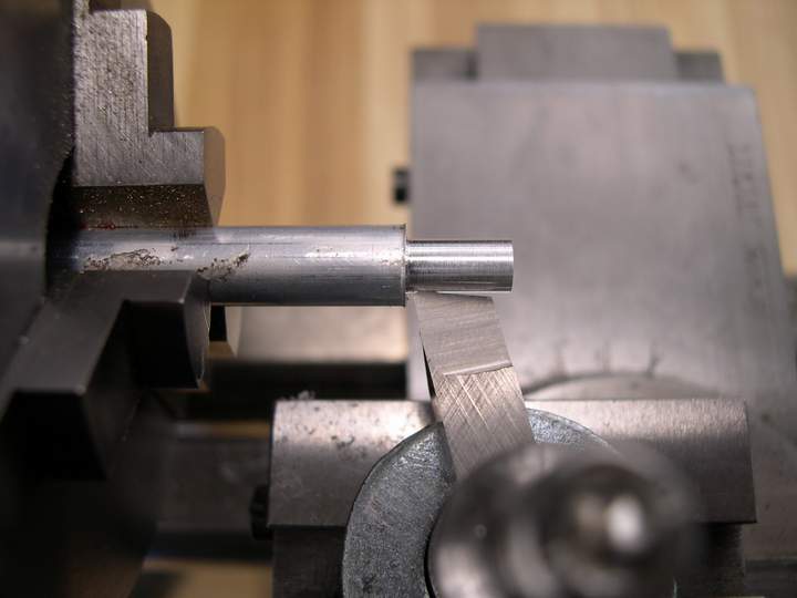 Turning a part on a lathe cross slide.